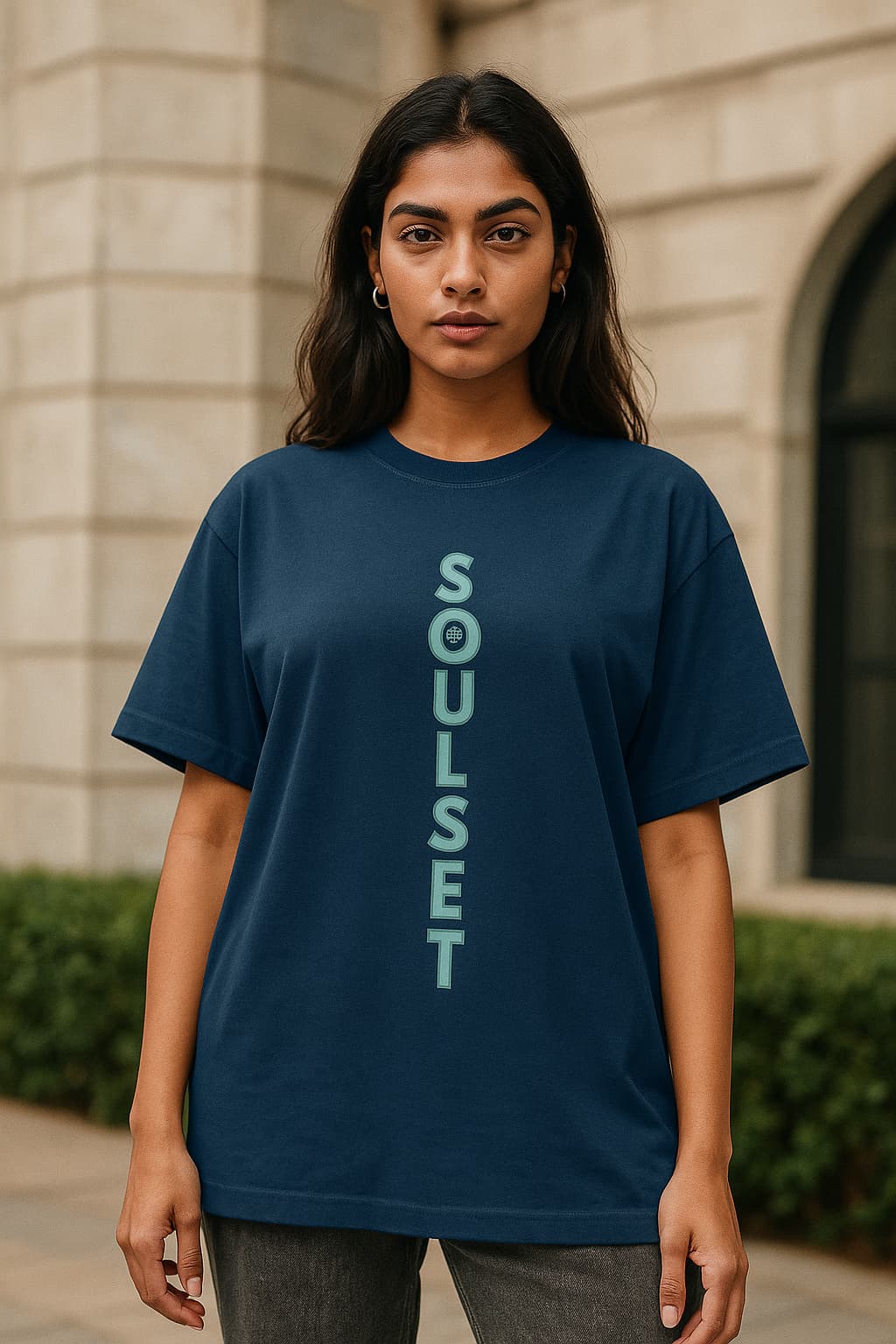 Person wearing a blue t-shirt with 'Soulset' logo outdoors.