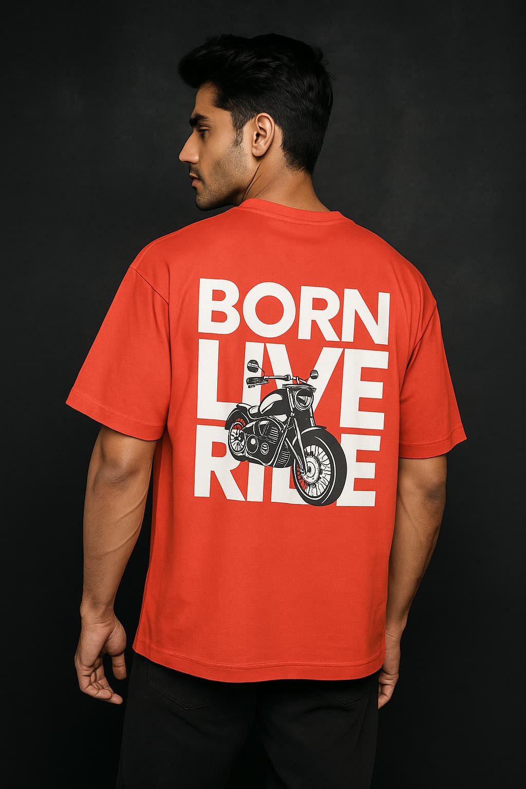 Person wearing a red t-shirt with 'Born to Live, Ride' text and motorcycle graphic on the back against a black background.