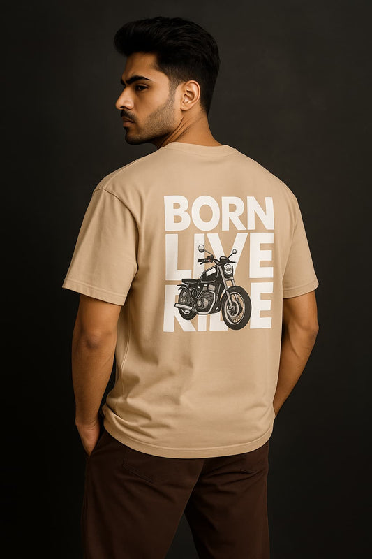 Man wearing a beige t-shirt with 'Born to Live, Ride' text and motorcycle graphic on the back against a black background.