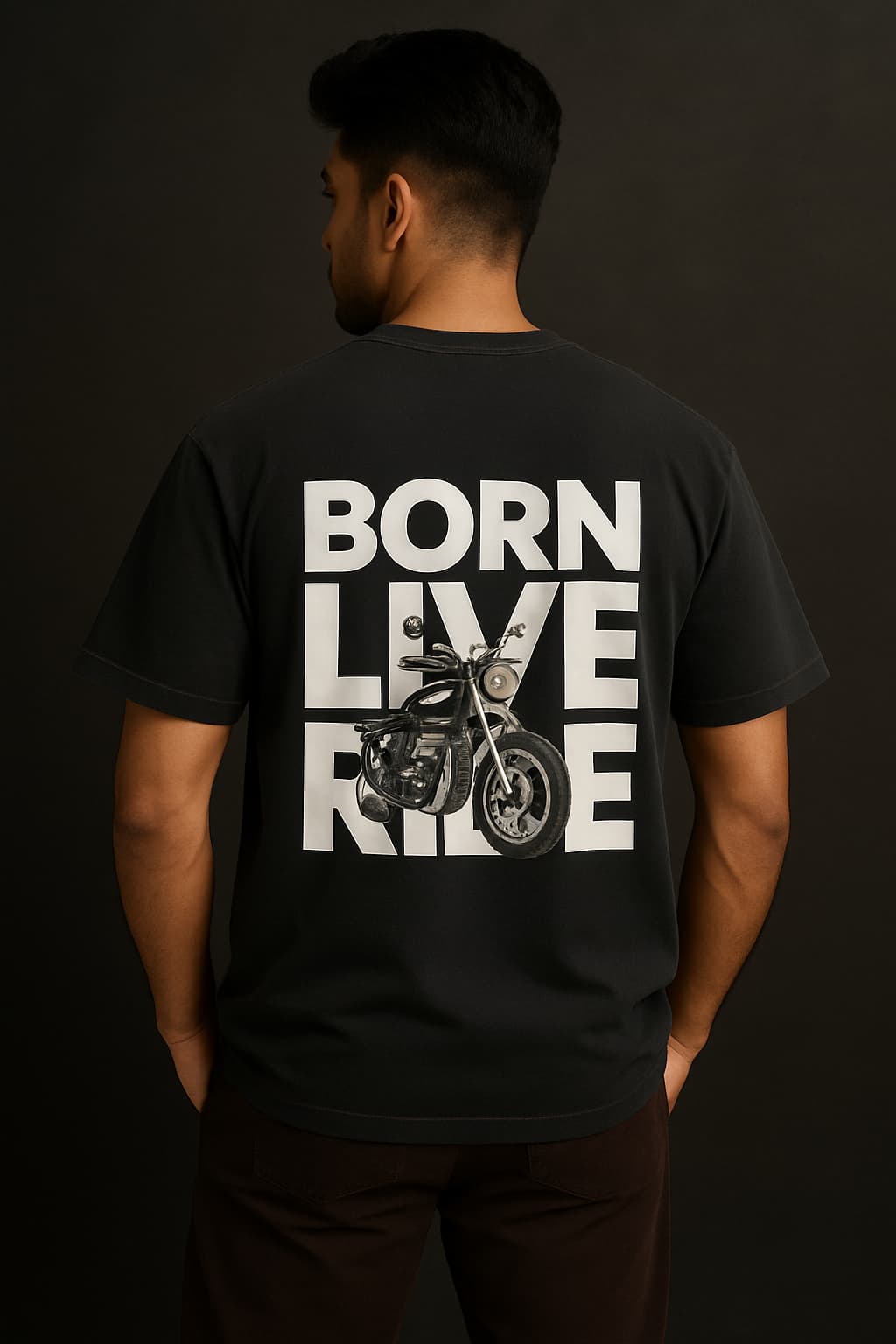 Person wearing a black t-shirt with 'Born Live Ride' text and motorcycle graphic on the back against a dark background.