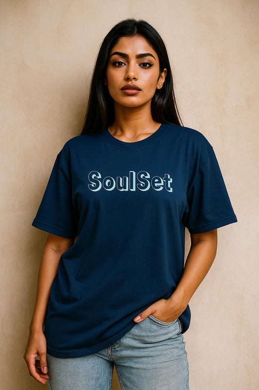 Woman wearing a navy blue t-shirt with 'SoulSet' text against a beige background