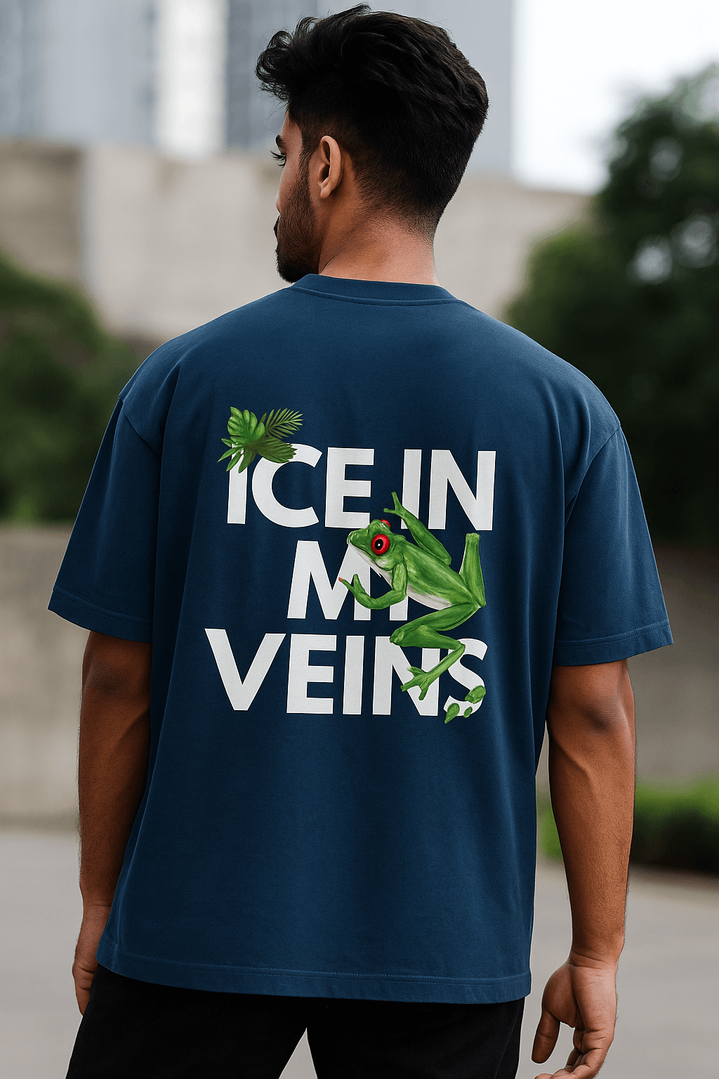 Stylish Indian male model wearing navy blue oversized t-shirt with bold back design ‘ICE IN MY VEINS’ and green frog graphic, modern streetwear fashion, SoulSet exclusive