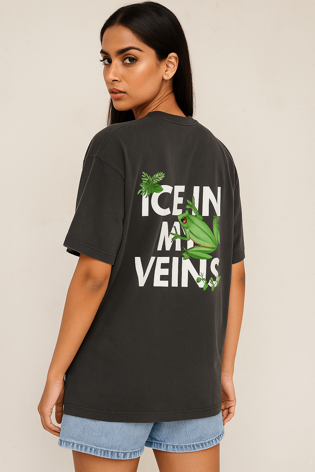 Stylish Indian female model in SoulSet oversized black T-shirt featuring ‘Ice in My Veins’ frog graphic – premium cotton streetwear for bold fashion