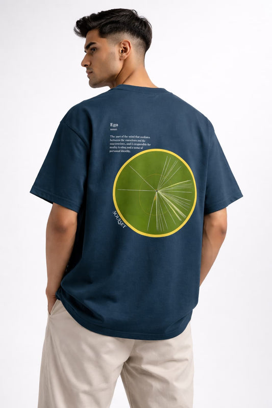 Person wearing a navy blue t-shirt with a green circular design on the back, standing against a white background.