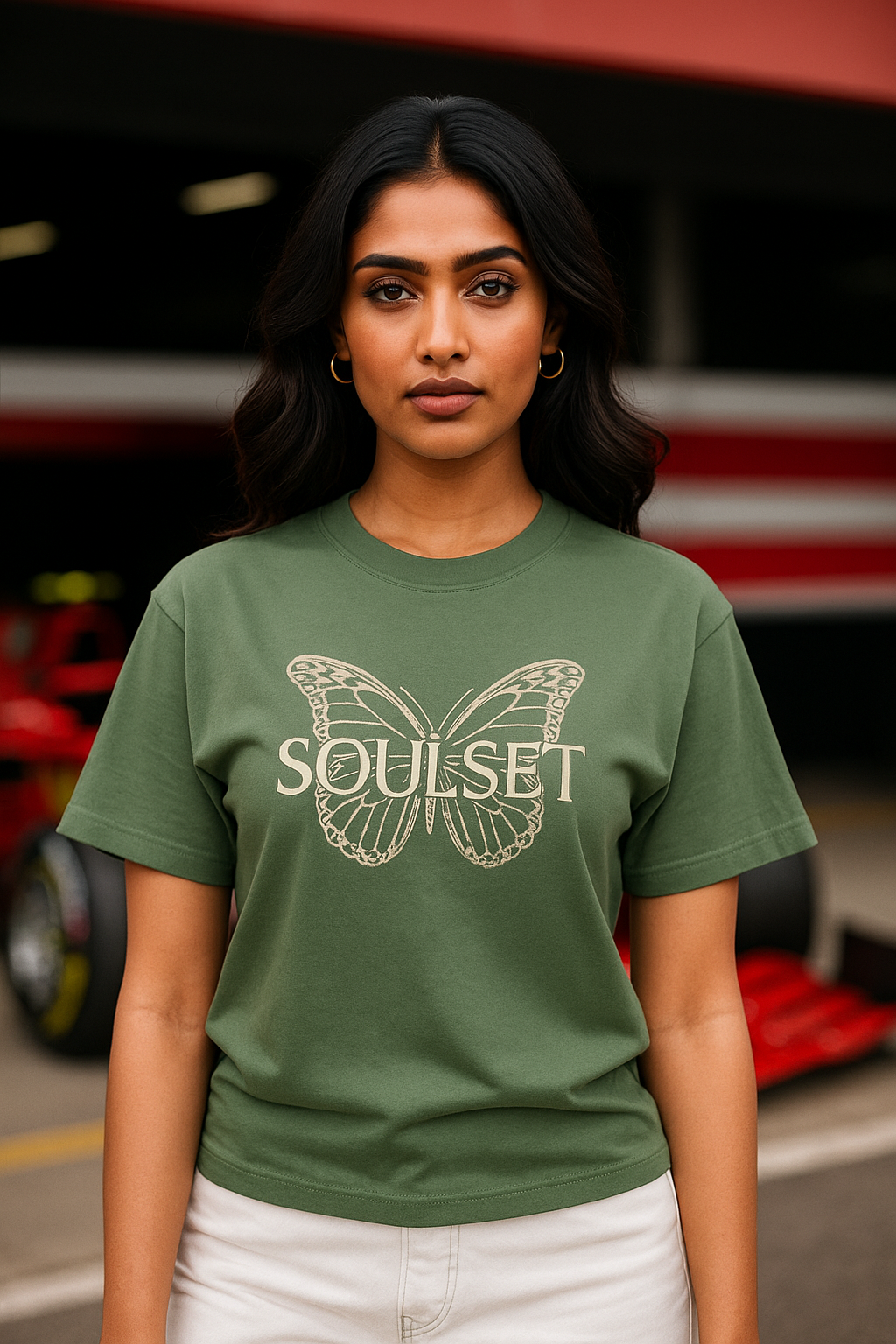 Confident young Indian female model wearing an oversized forest green t-shirt with a ‘KAIZEN’ themed back design featuring a butterfly and evolution graphics. The model stands stylishly in a relaxed pose, showcasing the t-shirt’s fit and artwork against a sleek, minimalist backdrop. Ideal for fashion e-commerce, streetwear, and self-growth inspired apparel collections.