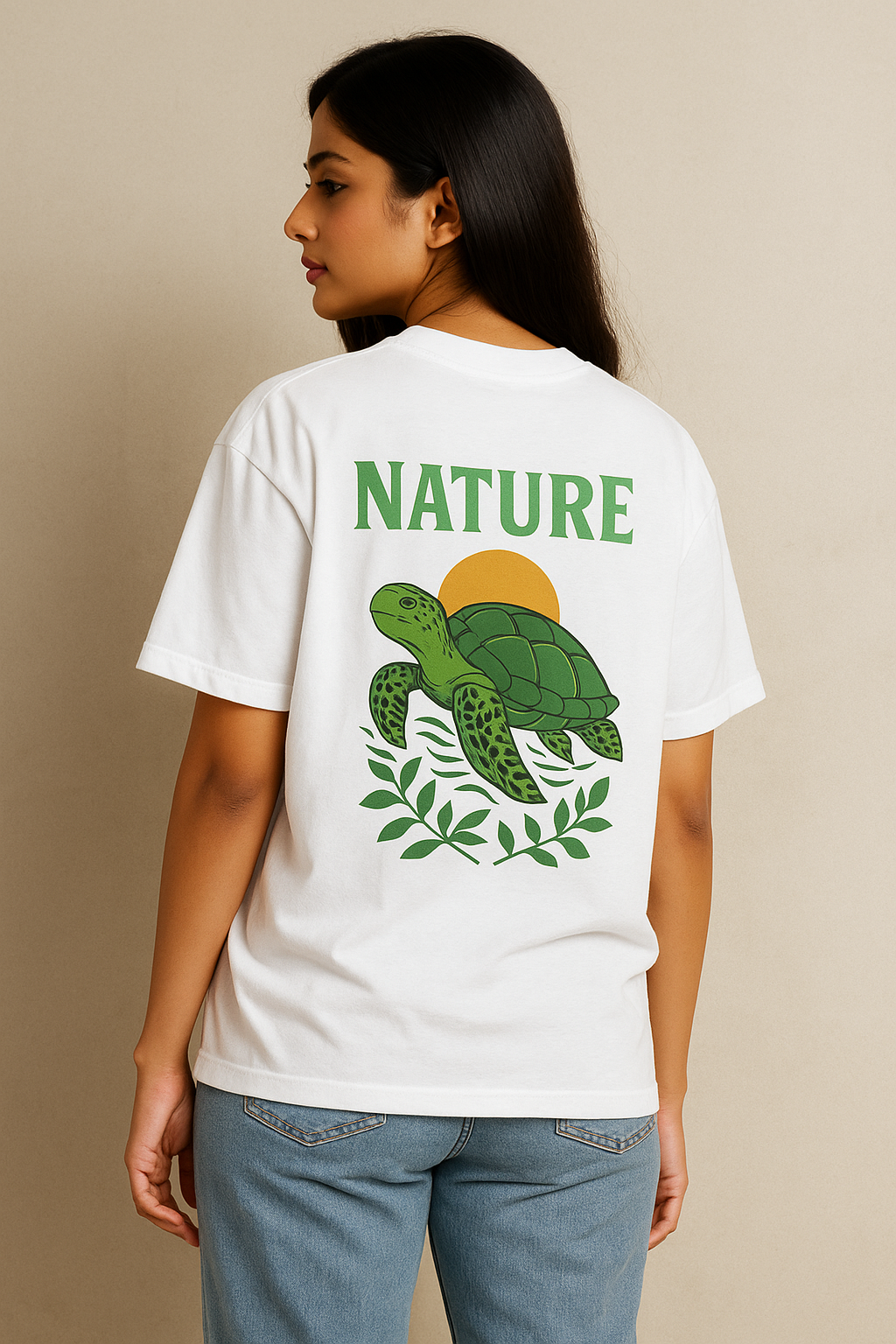 Person wearing a white t-shirt with a turtle graphic and 'NATURE' text on the back.