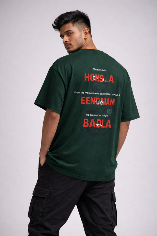 Man wearing a green t-shirt with text on the back against a white background