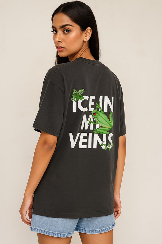 Woman wearing a black t-shirt with a graphic design and text on the back.