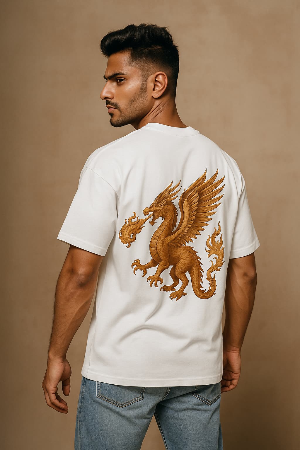 Man wearing a white t-shirt with a gold dragon design on the back against a beige background