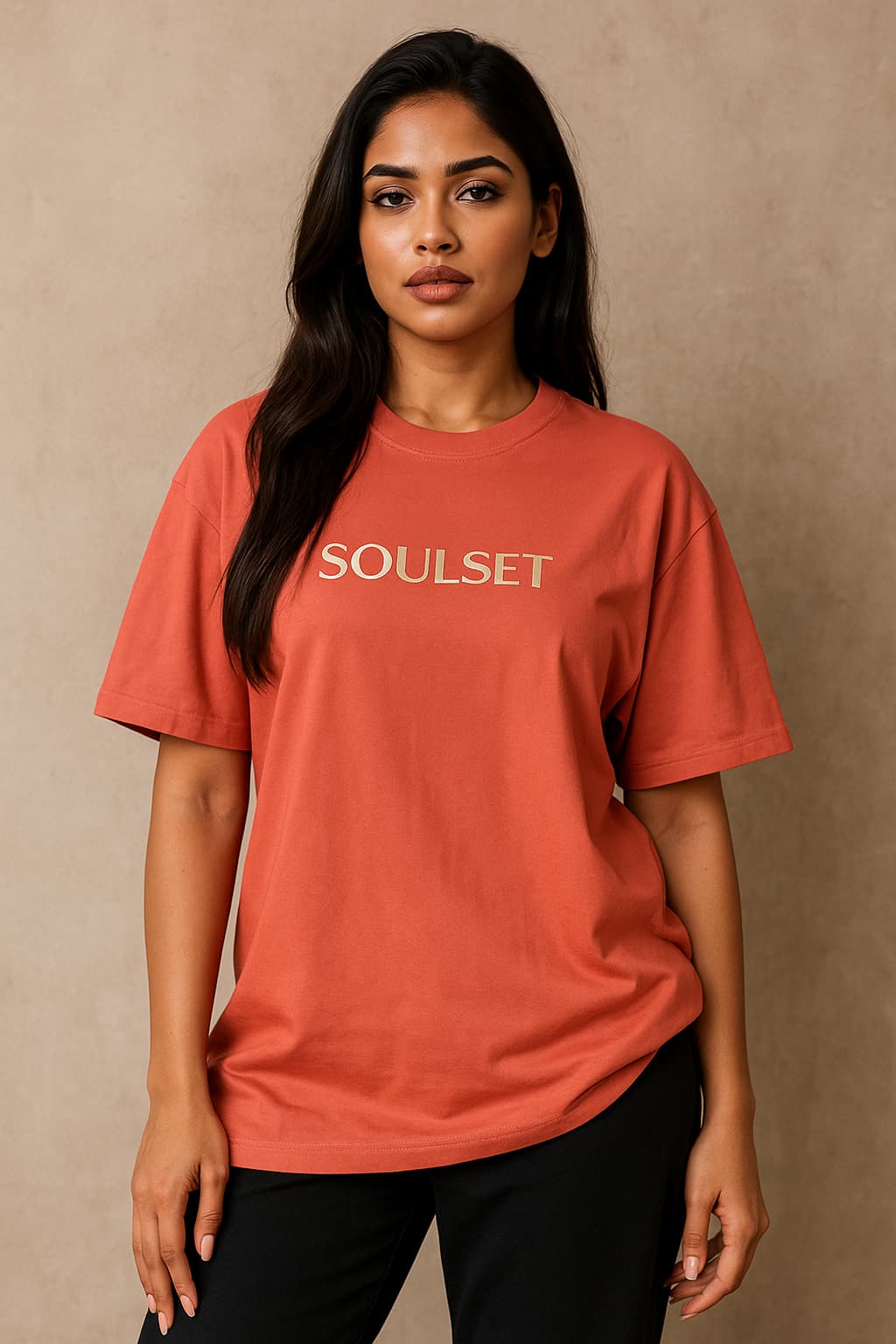 Woman wearing a red 'SOUSET' t-shirt against a beige background