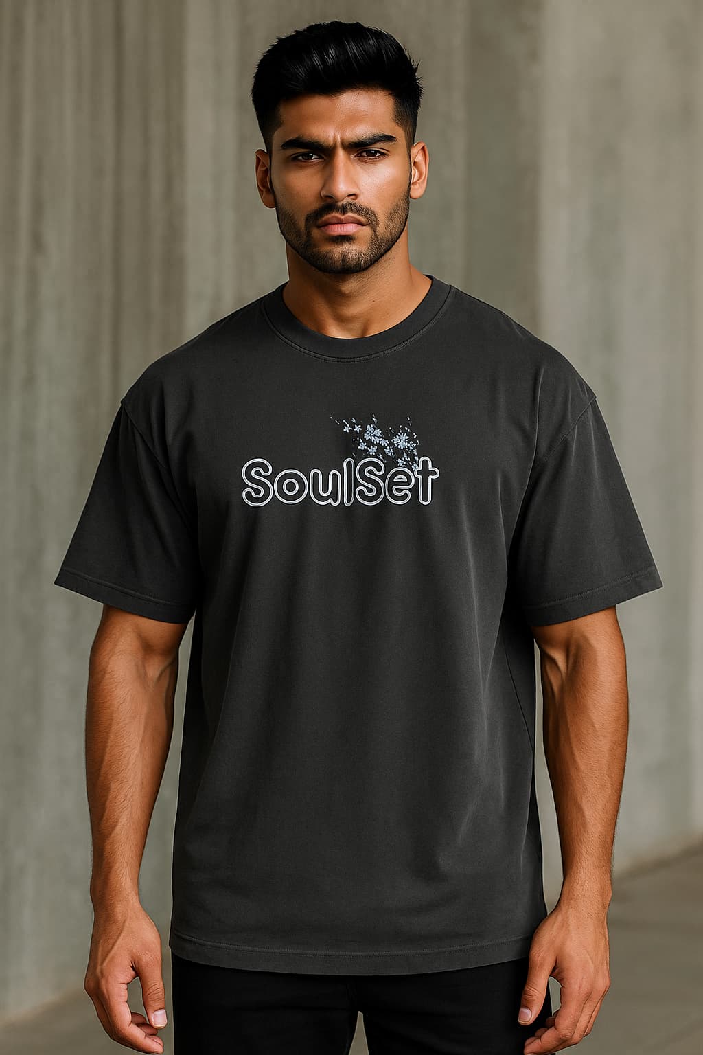 Man wearing a black t-shirt with 'SoulSet' logo against a gray background