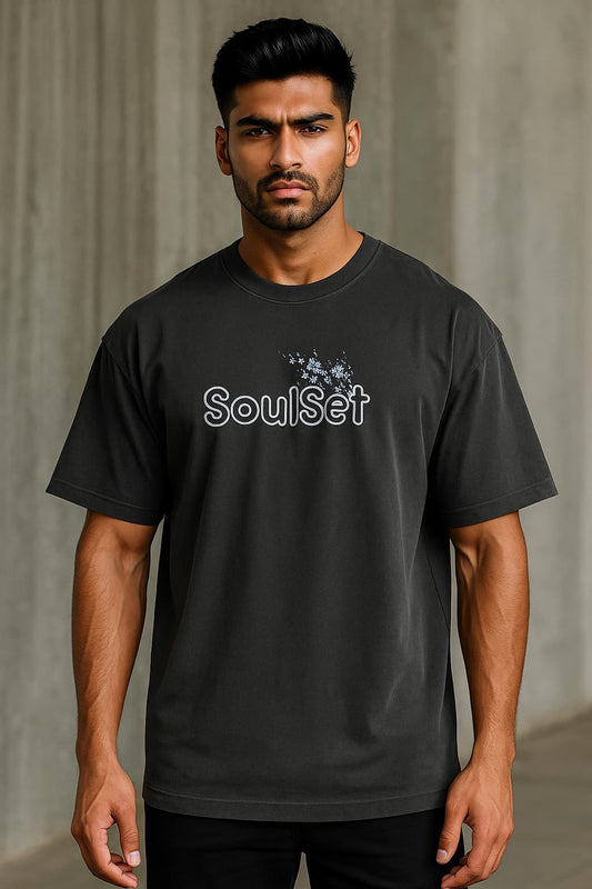 Man wearing a black t-shirt with 'SoulSet' logo against a gray background