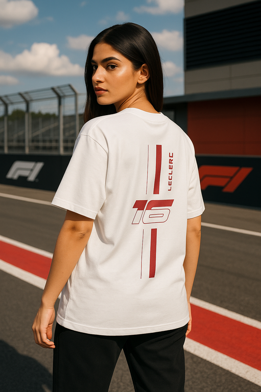 Person wearing a white t-shirt with red graphics on a race track