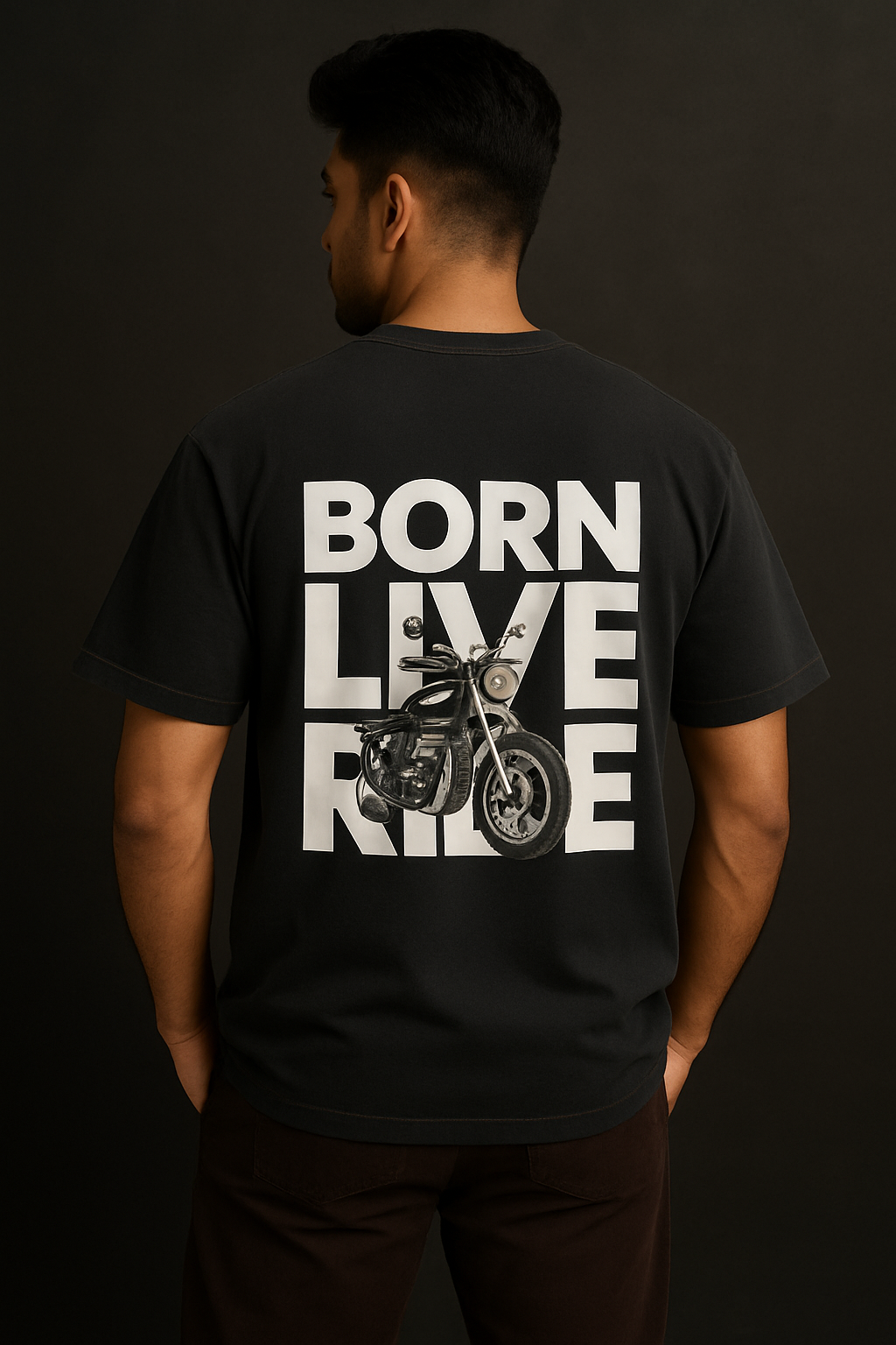Person wearing a black t-shirt with 'BORN LIVE RIDE' text and motorcycle graphic on the back against a dark background.