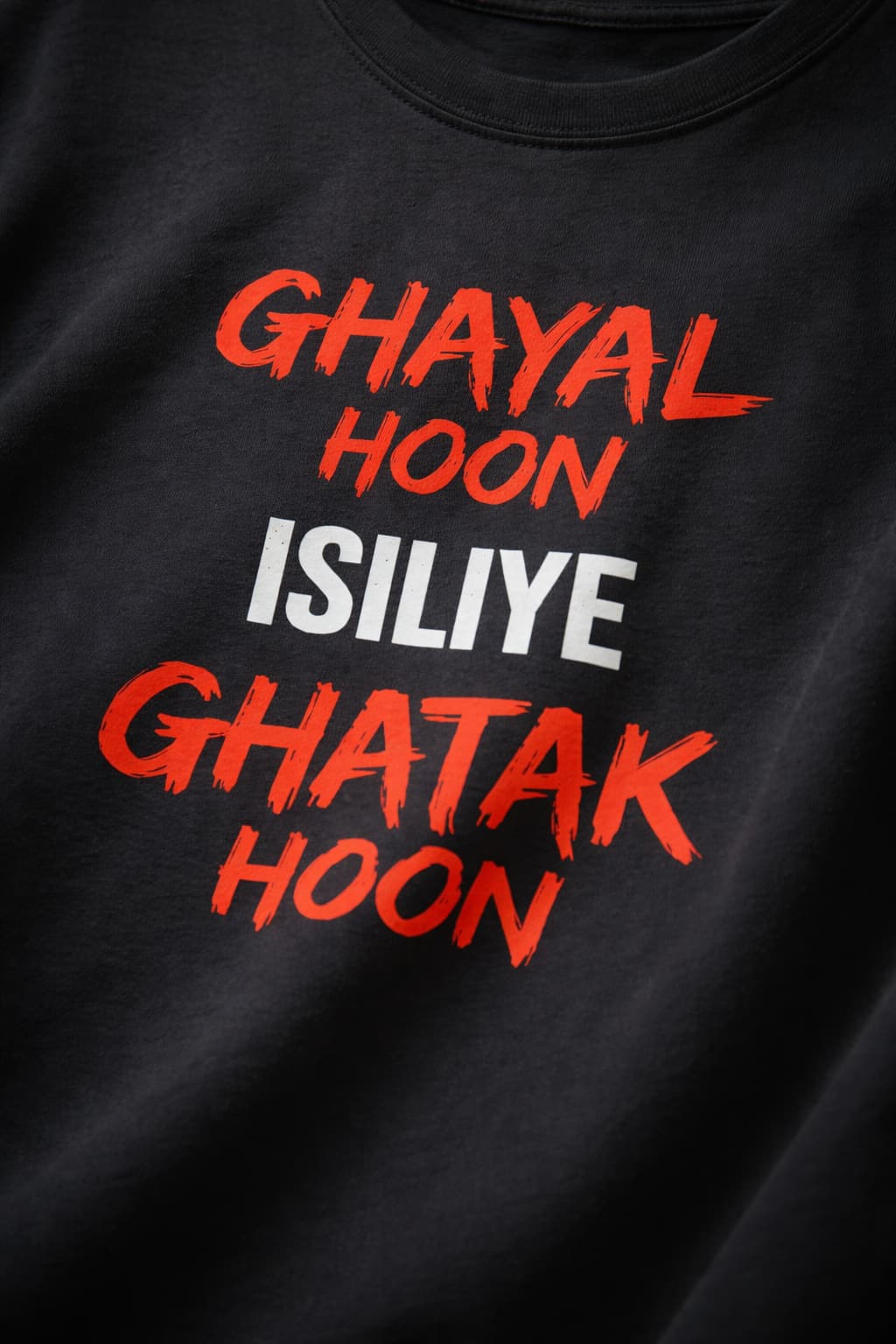 Black t-shirt with red and white text on a plain background