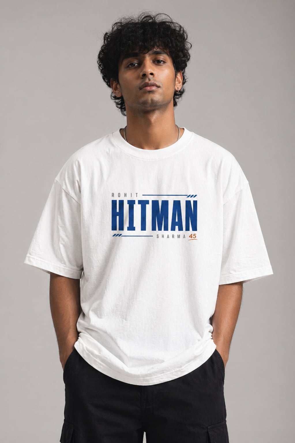 Person wearing a white t-shirt with 'HITMAN' branding on a gray background