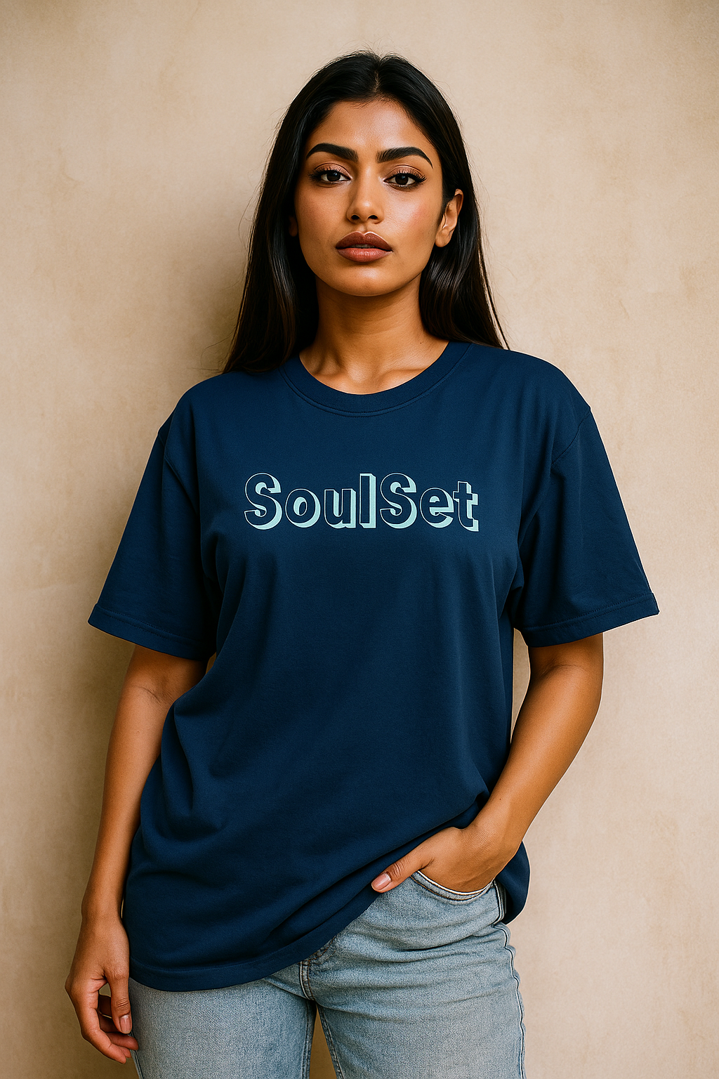 Woman wearing a navy blue t-shirt with 'SoulSet' text against a beige background