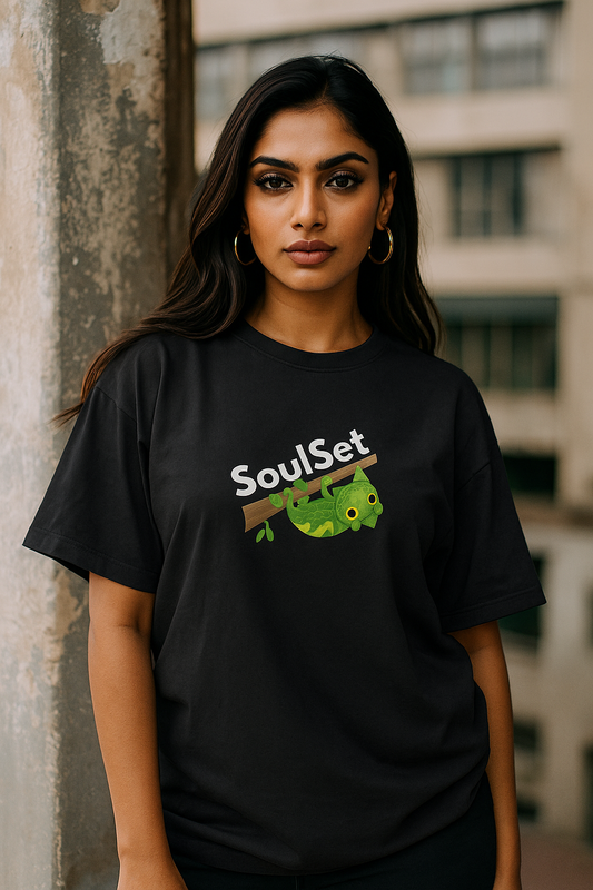 Indian female model wearing black oversized premium T-shirt with bold back design featuring green chameleon and text 'Stay True' – trendy streetwear fashion for women by SoulSet.