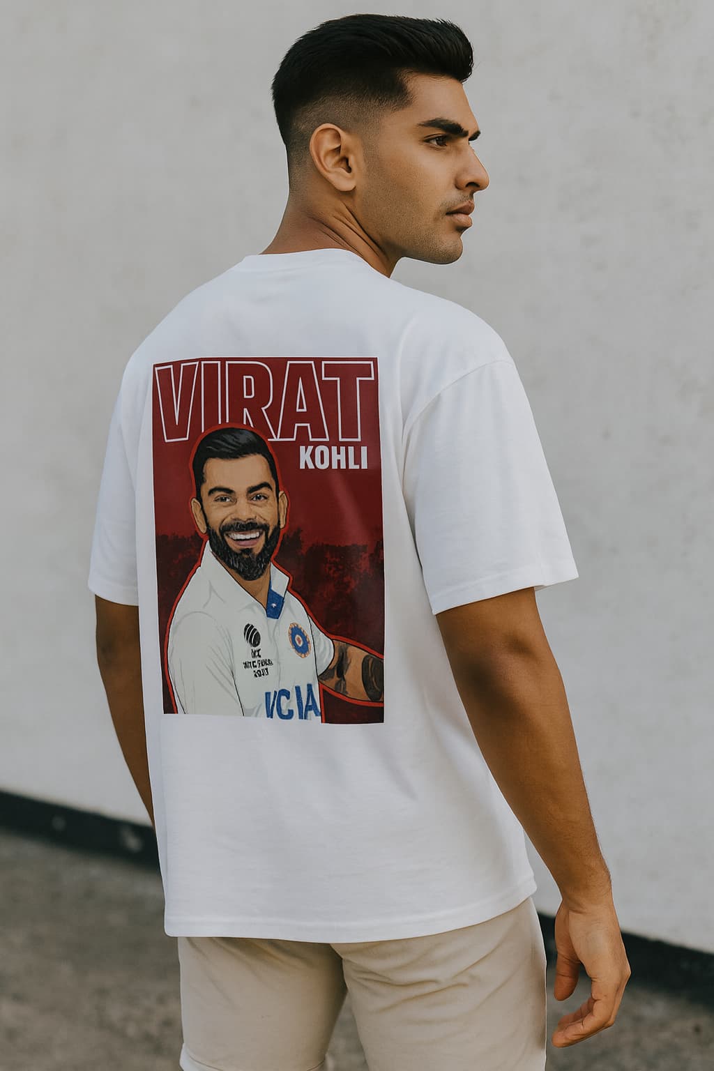 Man wearing a white t-shirt with a graphic of Virat Kohli on the back.