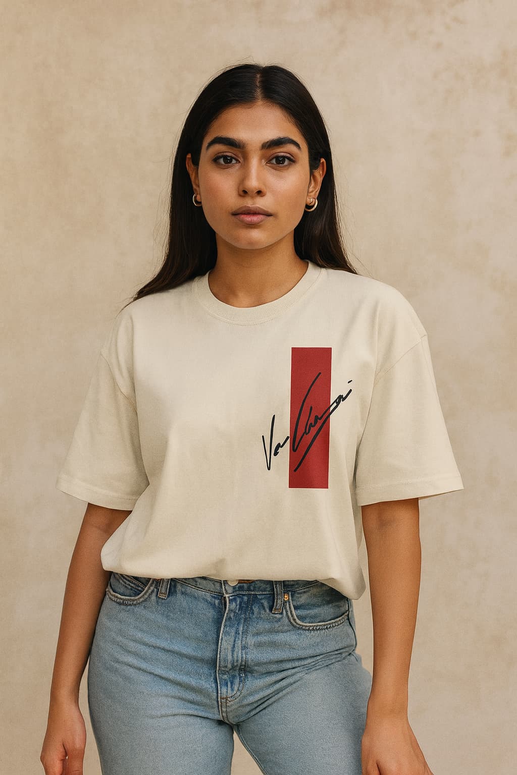 Person wearing a white t-shirt with a red and black logo on a beige background