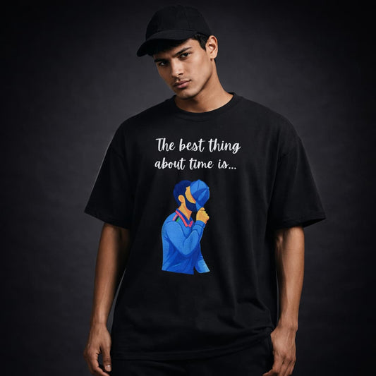 Person wearing a black t-shirt with a graphic and text on a dark background