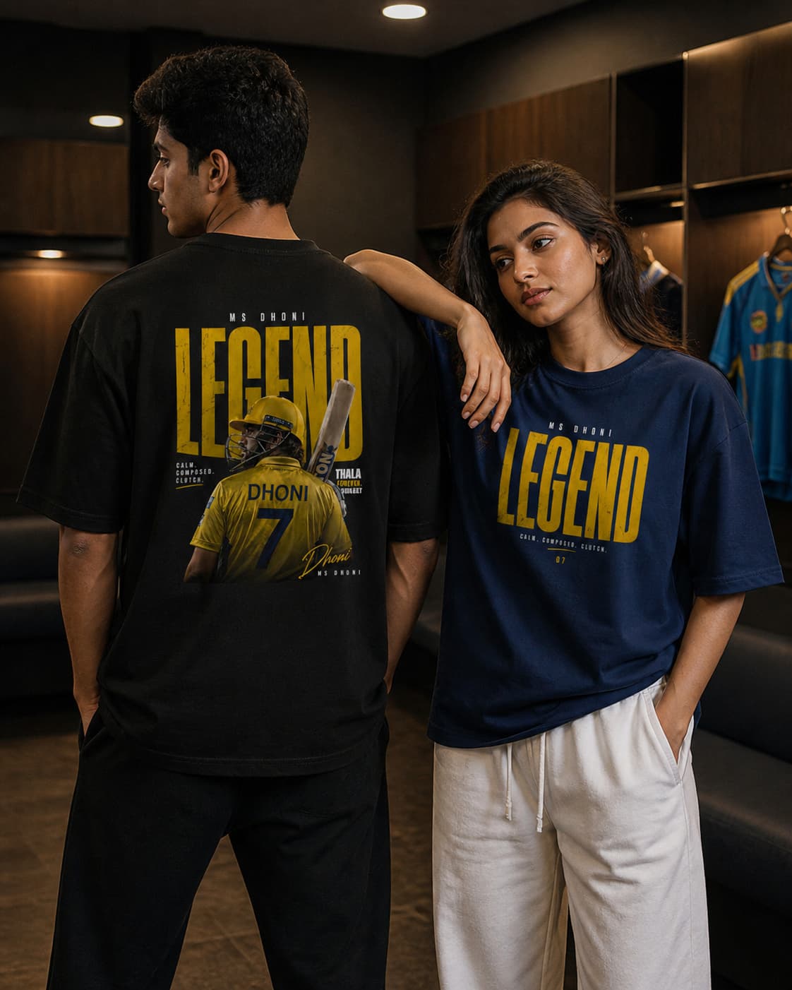 Two people wearing t-shirts with 'LEGEND' text and a sports theme in an indoor setting.