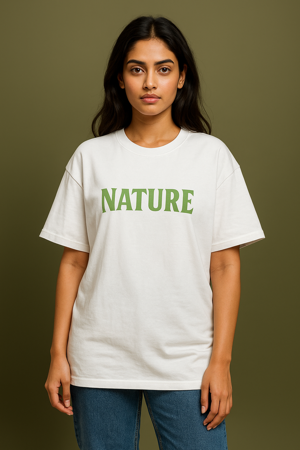 Person wearing a white t-shirt with 'NATURE' printed in green on a brown background