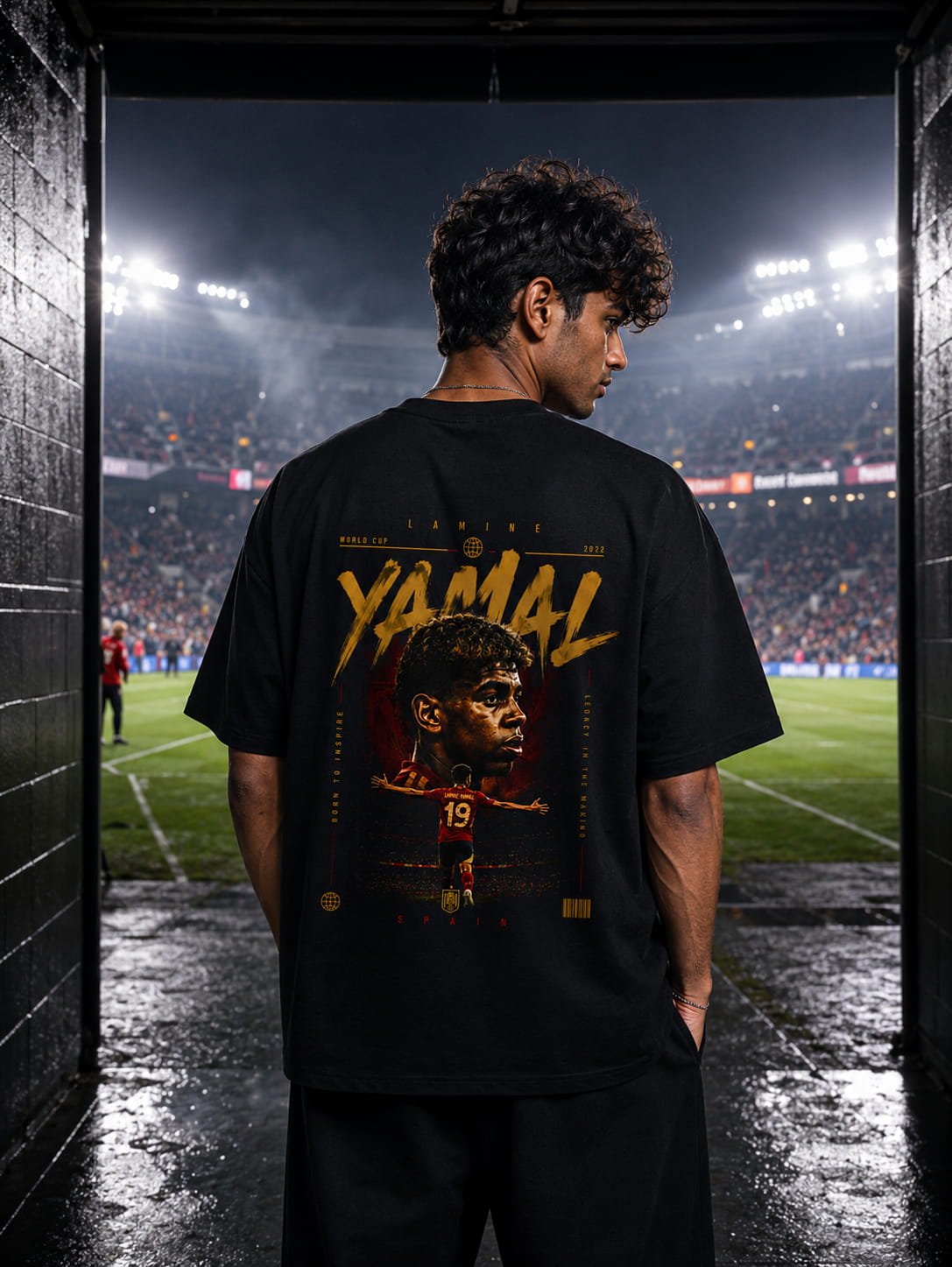 Person wearing a black t-shirt with 'YAMAL' and a graphic of a football player on a stadium background