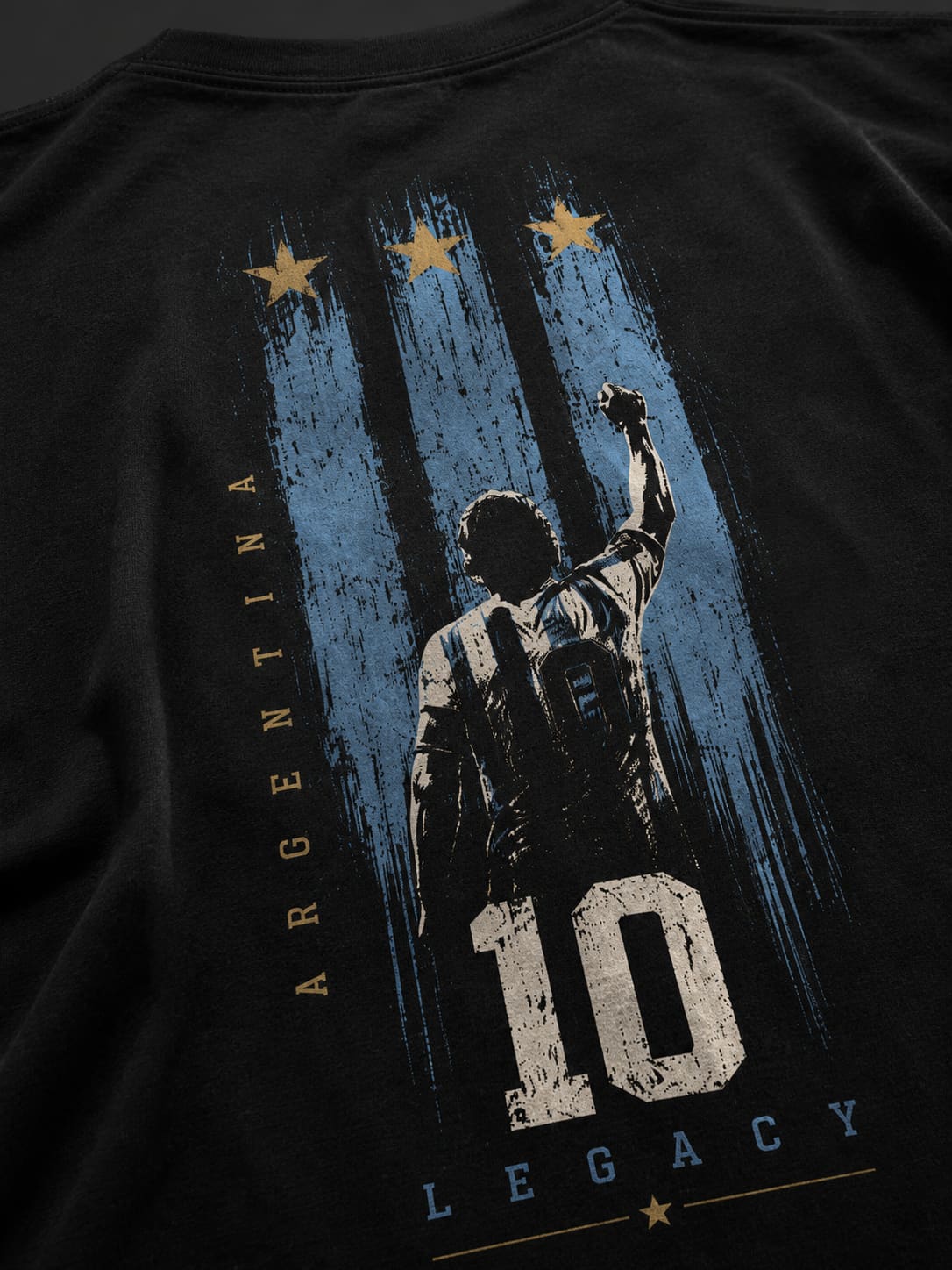 Black t-shirt with a graphic of a silhouette, number 10, and 'Argentina' text on a dark background
