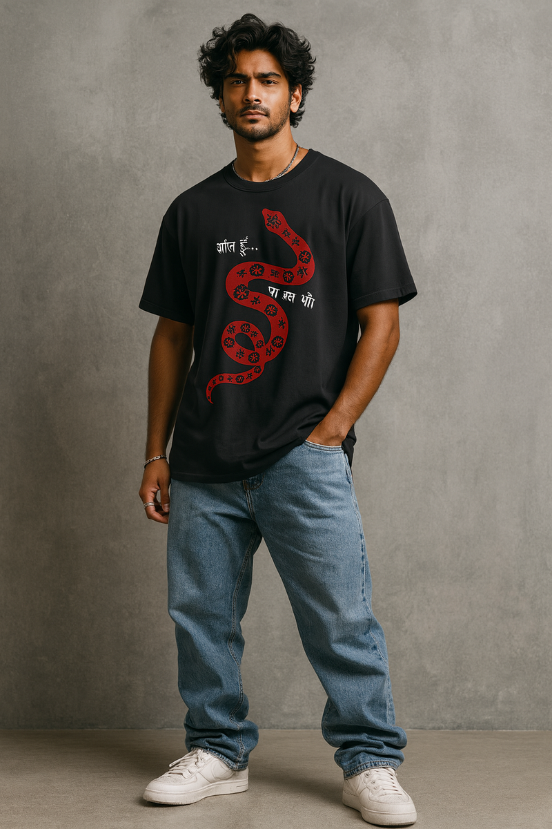 Man wearing a black t-shirt with a red snake design against a gray background