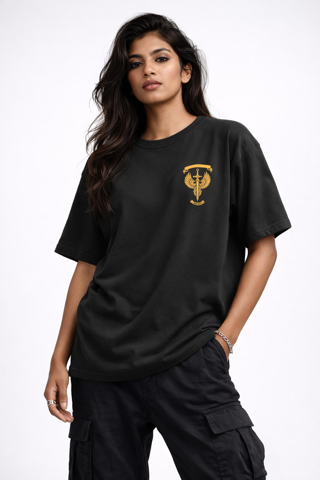 Woman wearing a black t-shirt with a gold emblem on a white background