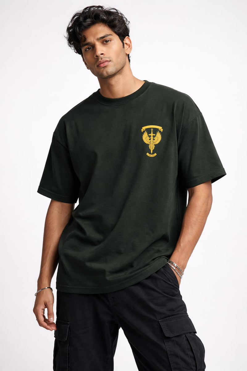 Man wearing a black t-shirt with a yellow logo on a white background