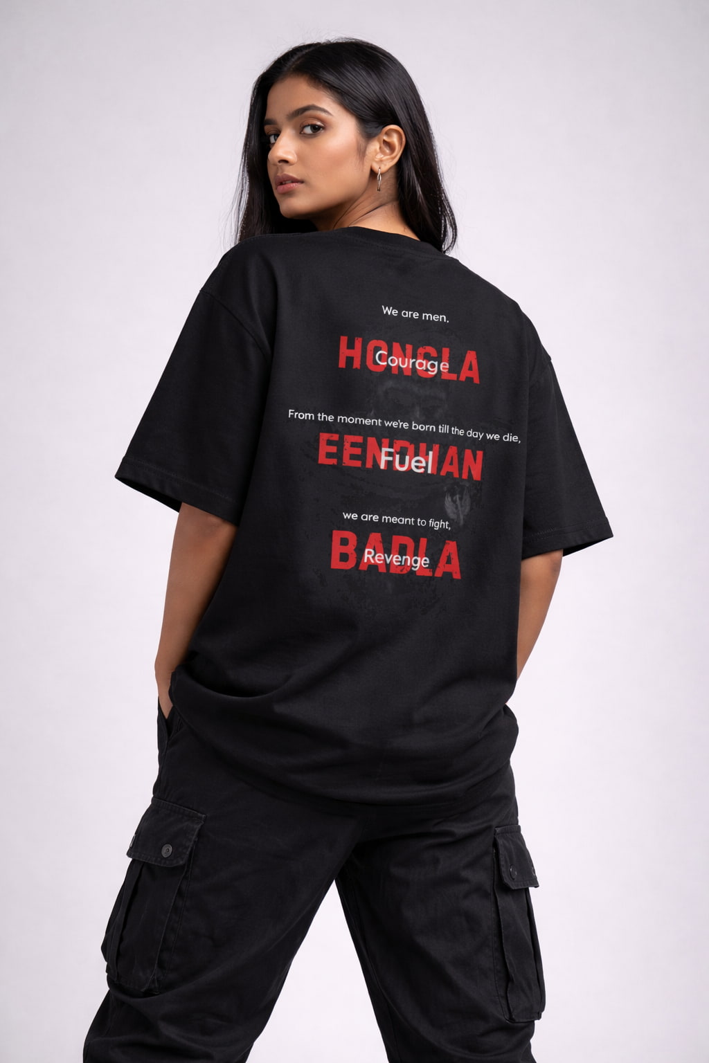 Person wearing a black t-shirt with red and white text on a white background