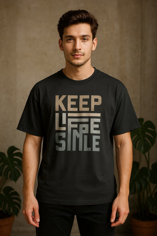 Man wearing a black t-shirt with 'KEEP LIFE SIMPLE' text against a brown background