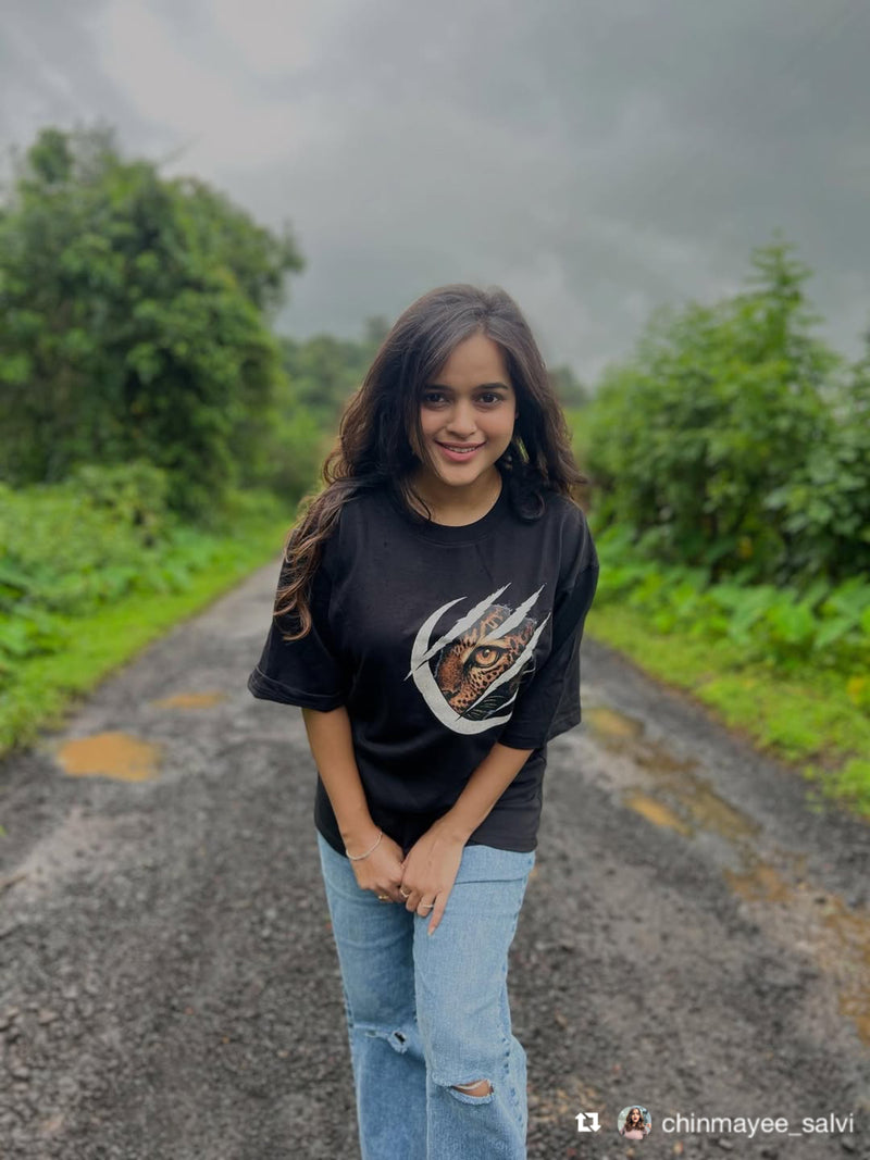 Chinamyee Salvi wearing the Soulset Paw Clash Tee: a blackt-shirt with a Tiger Claw design on front