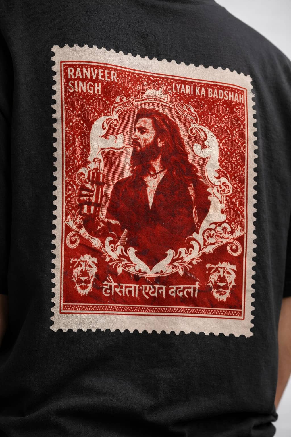 Black t-shirt with a red and white graphic of Ranveer Singh on the back
