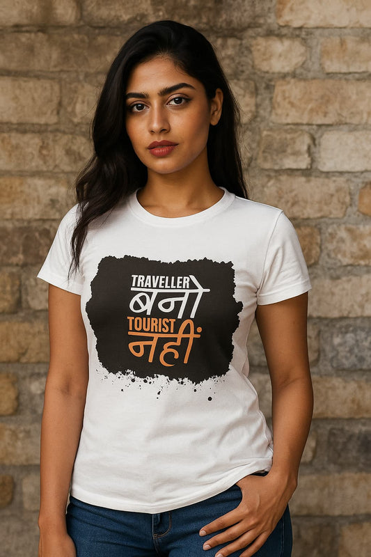 Woman wearing a white t-shirt with a black and orange graphic design against a brick wall.
